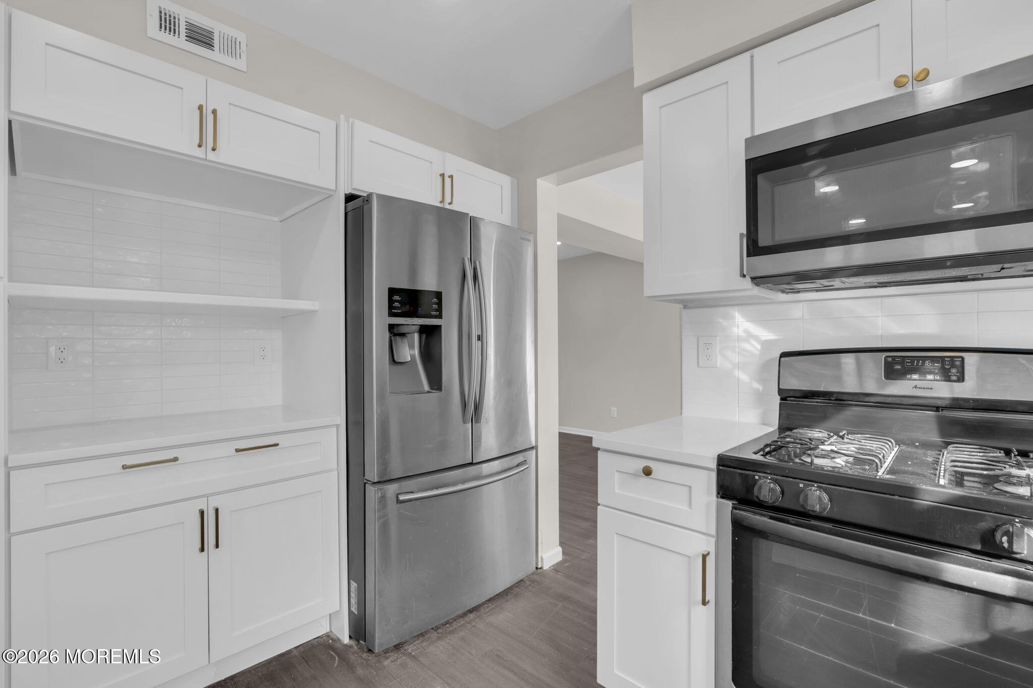 45 Peachstone Road Howell, NJ 07731 - Photo 27 of 54 a kitchen with a stove and a refrigerator