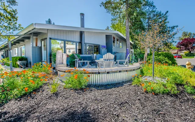 a front view of a house with fountain