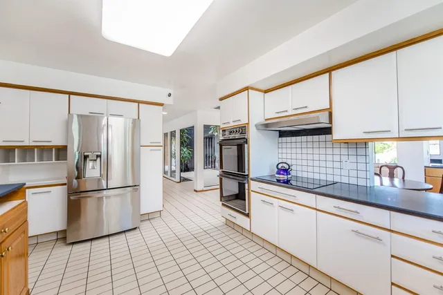 a living room with furniture cabinets and a book shelf