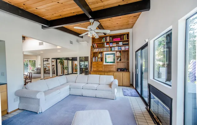 a bathroom with a sink vanity mirror and toilet