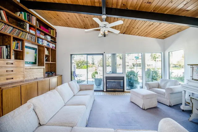 a bathroom with a sink a toilet and a window