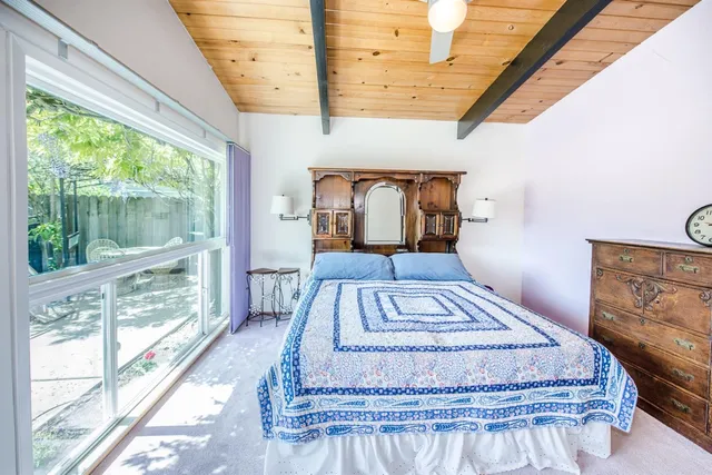 a dining room with furniture and a window