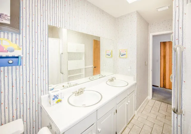 a view of a house with a flower garden