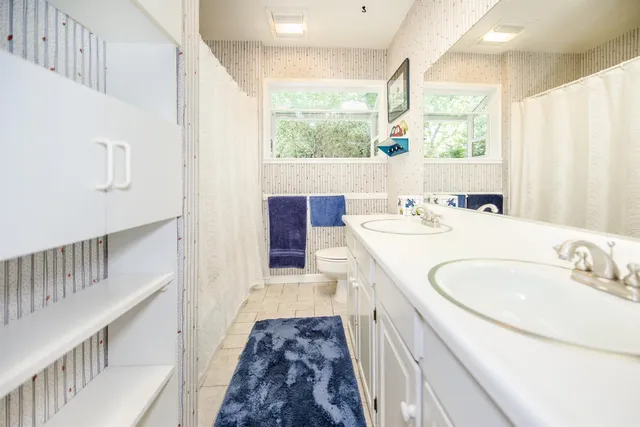 a view of a patio with table and chairs and potted plants