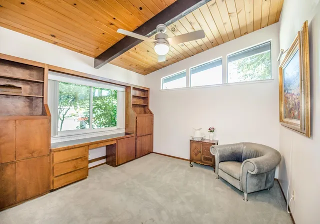 a view of a swimming pool with outdoor seating