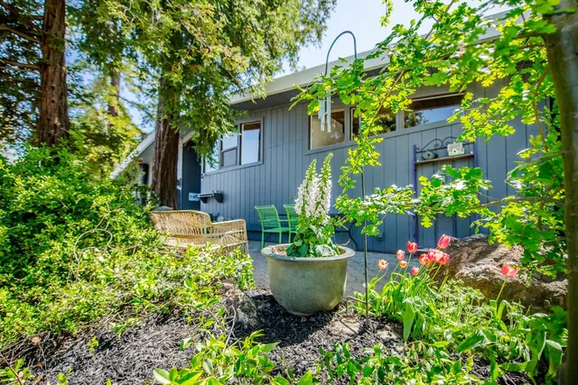 a view of a chairs and table in the patio