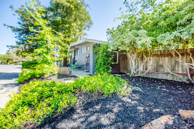 a view of a street with sitting area and street