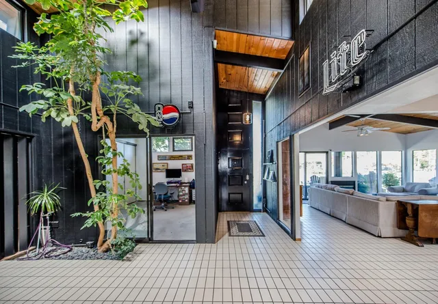 a kitchen with stainless steel appliances a refrigerator sink and cabinets