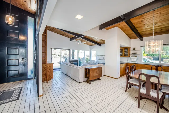 a kitchen with a sink a counter top space and stainless steel appliances
