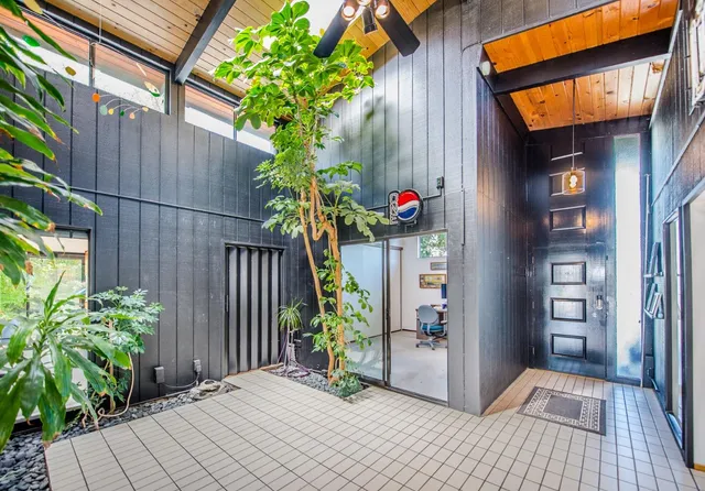 a kitchen with a stove a sink and a refrigerator