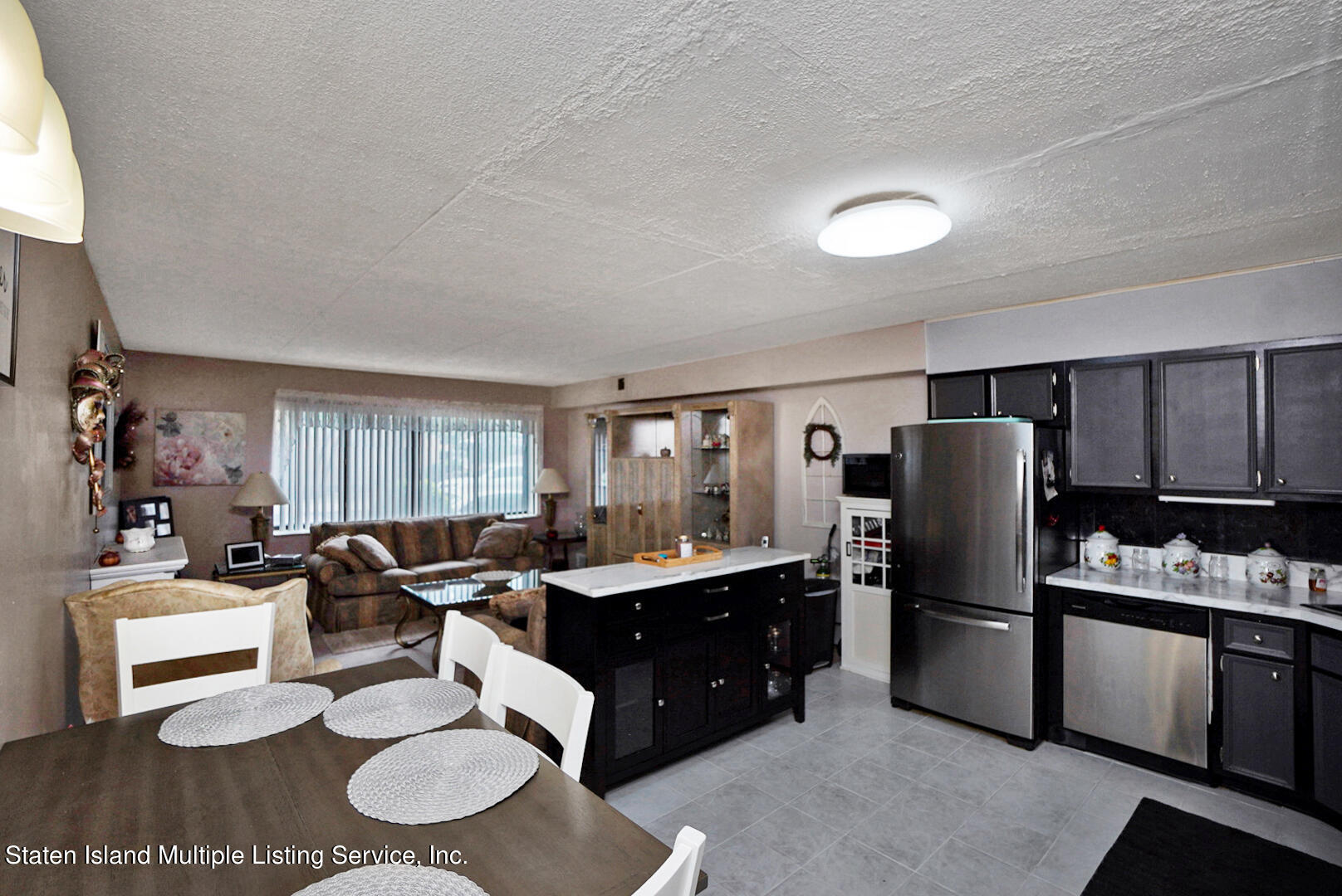 10 Windham Loop, Unit 1A Staten Island, NY 10314 - Photo 7 of 19 a kitchen with a refrigerator and a stove top oven