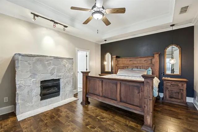 a spacious bathroom with a bathtub a mirror and a sink