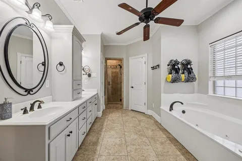 a bathroom with mirror sink and a mirror