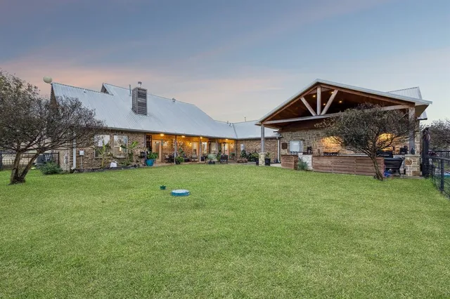 a aerial view of a house with a yard