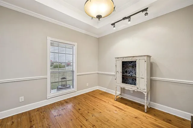 a living room with a couch and a view of dining table