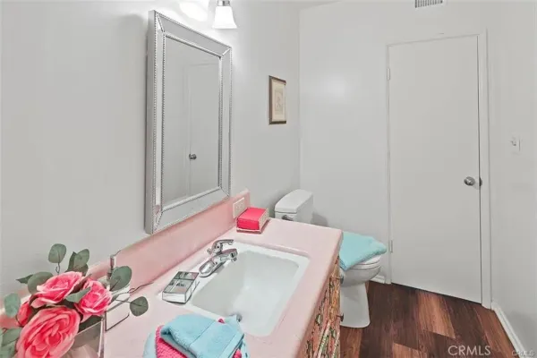 a view of hallway with wooden floor