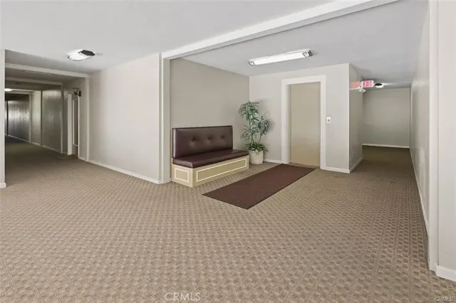 a living room with a toilet and a shower