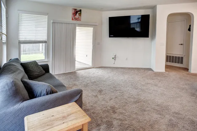 a kitchen with stainless steel appliances a refrigerator and a stove top oven