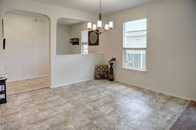 a kitchen with cabinets appliances and a sink