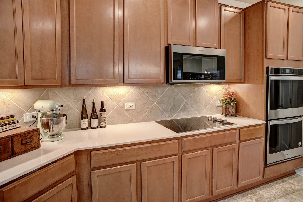 1928 Dragonfly Loop Bastrop, TX 78602 - Photo 20 of 32 a kitchen with cabinets appliances and a sink