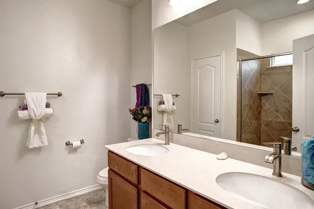 a bedroom with a bed and a desk