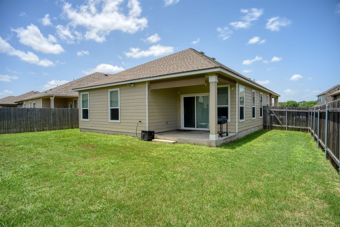 1928 Dragonfly Loop Bastrop, TX 78602 - Photo 28 of 32 a view of a house with backyard