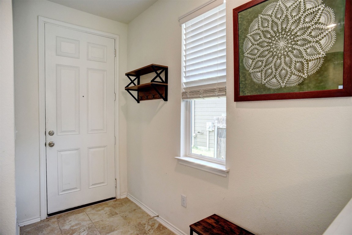 1928 Dragonfly Loop Bastrop, TX 78602 - Photo 6 of 32 a view of an entryway with a window