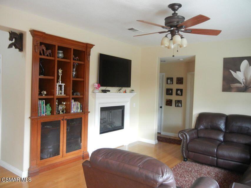 1128 Azalea Way Simi Valley, CA 93065 - Photo 7 of 21 a living room with furniture and a flat screen tv