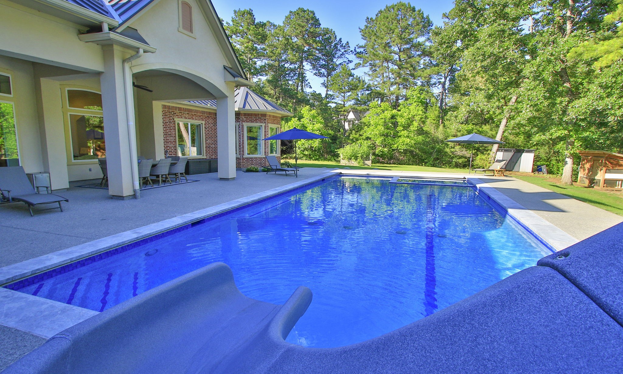 36702 Deer Valley Magnolia, TX 77355 - Photo 37 of 46 a view of swimming pool with lawn chairs and couches