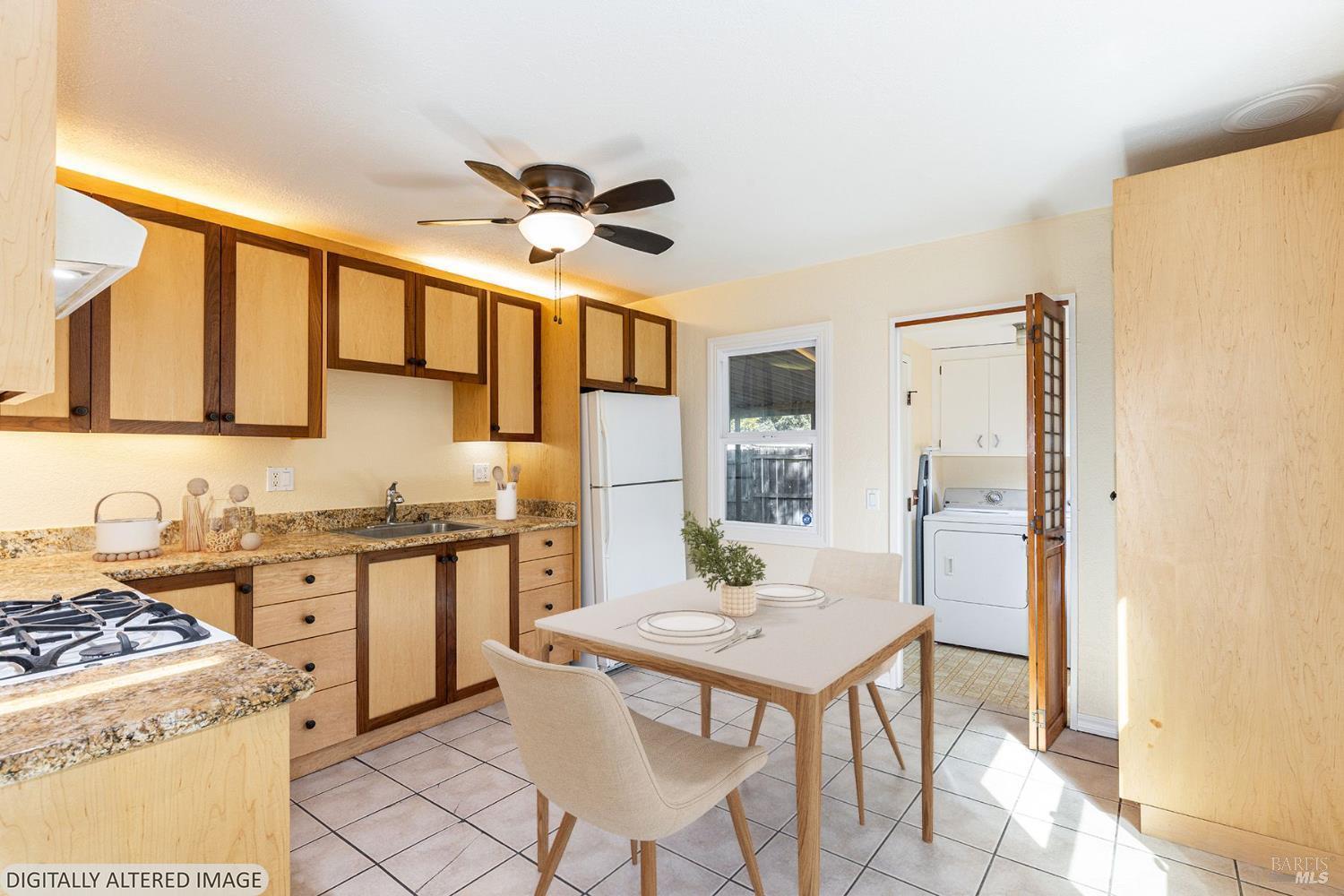 18090 Las Lomas Road Sonoma, CA 95476 - Photo 14 of 37 a kitchen with stainless steel appliances granite countertop a stove a sink dishwasher and a refrigerator with wooden floor