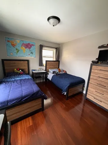 a bedroom with furniture and a window