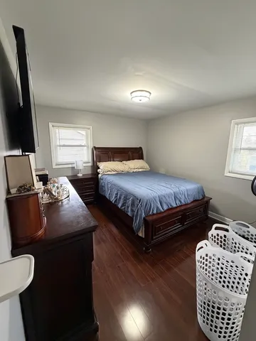 a bedroom with double bed and a window