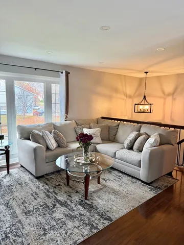 a living room with furniture and a rug