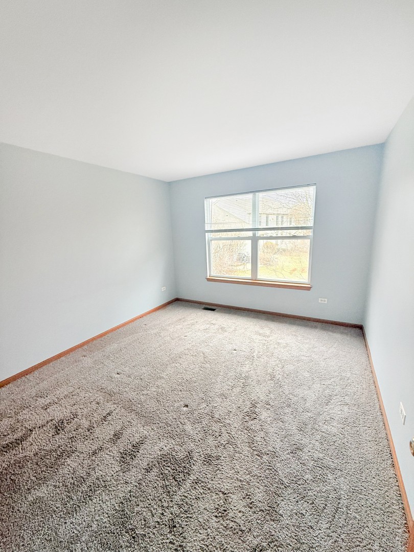 1533 Keystone Court Elgin, IL 60120 - Photo 12 of 15 an empty room with a window