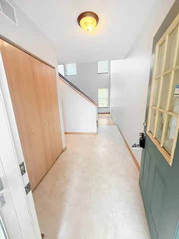 a view of a hallway with a window