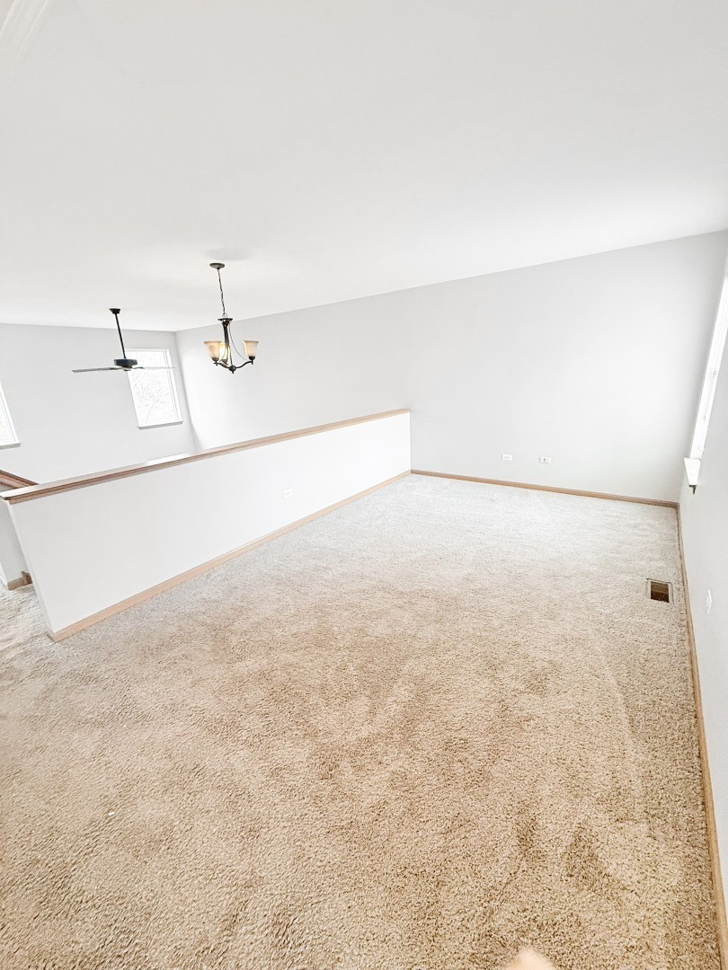 1533 Keystone Court Elgin, IL 60120 - Photo 9 of 15 a view of a refrigerator in an empty room