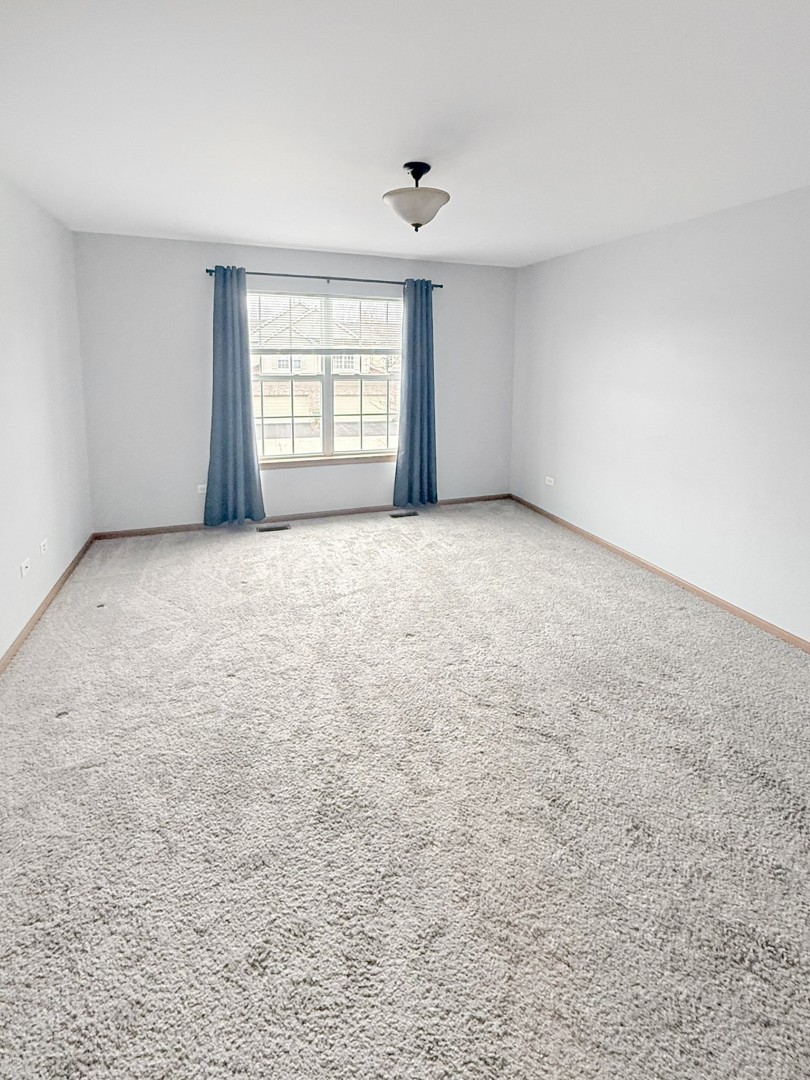 1533 Keystone Court Elgin, IL 60120 - Photo 10 of 15 an empty room with windows