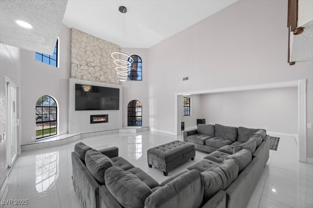 5110 Evaline Street Las Vegas, NV 89120 - Photo 2 of 55 Timeless living area features high ceiling, a fireplace and chandelier centerpiece!