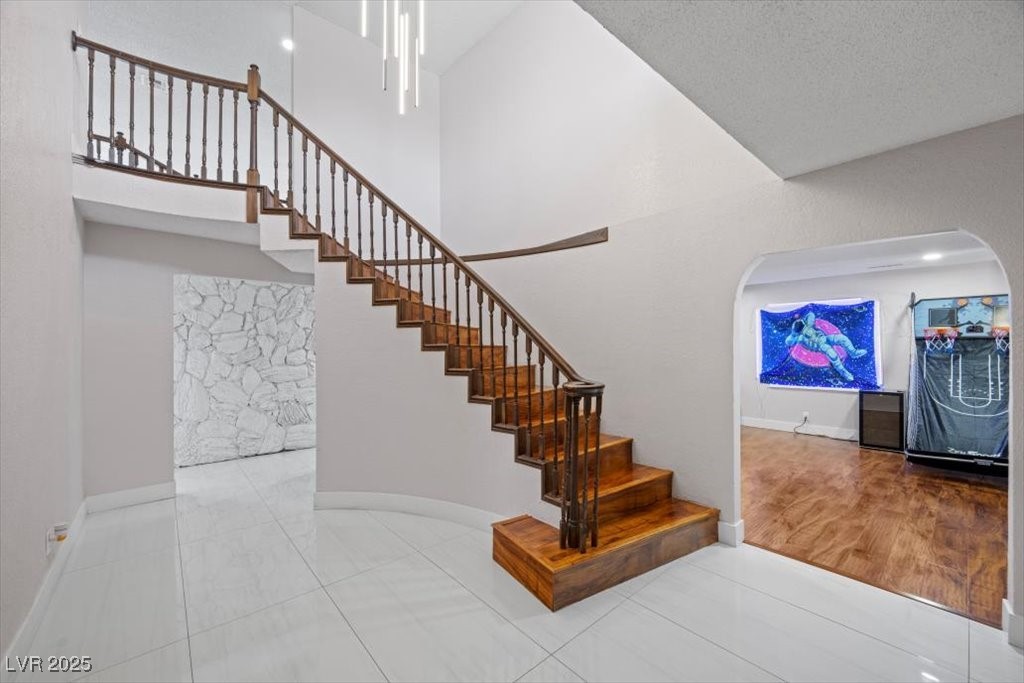 5110 Evaline Street Las Vegas, NV 89120 - Photo 34 of 55 Spacious entry features stunning staircase and luxurious chandelier!