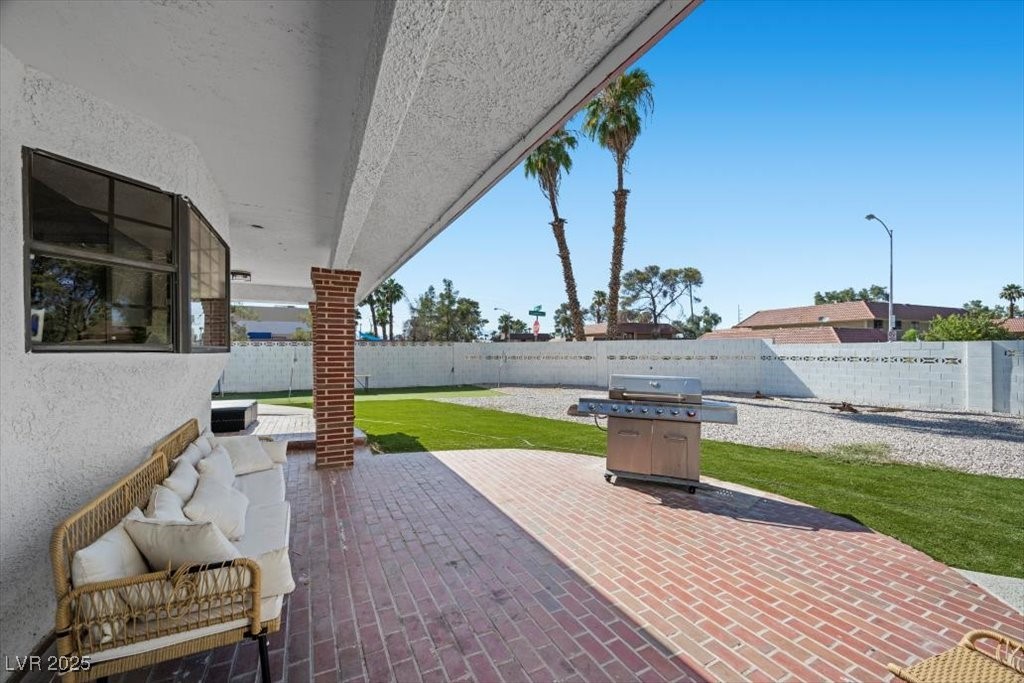 5110 Evaline Street Las Vegas, NV 89120 - Photo 35 of 55 Step outside to an oversized covered patio, perfect for relaxing & entertaining!