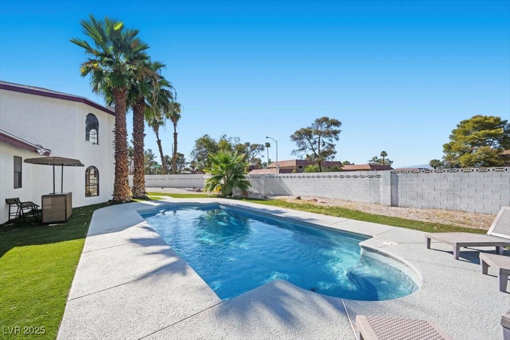 5110 Evaline Street Las Vegas, NV 89120 - Photo 36 of 55 The backyard features a sparkling pool—perfect for cooling off, lounging, or enjoying sunny afternoons!
