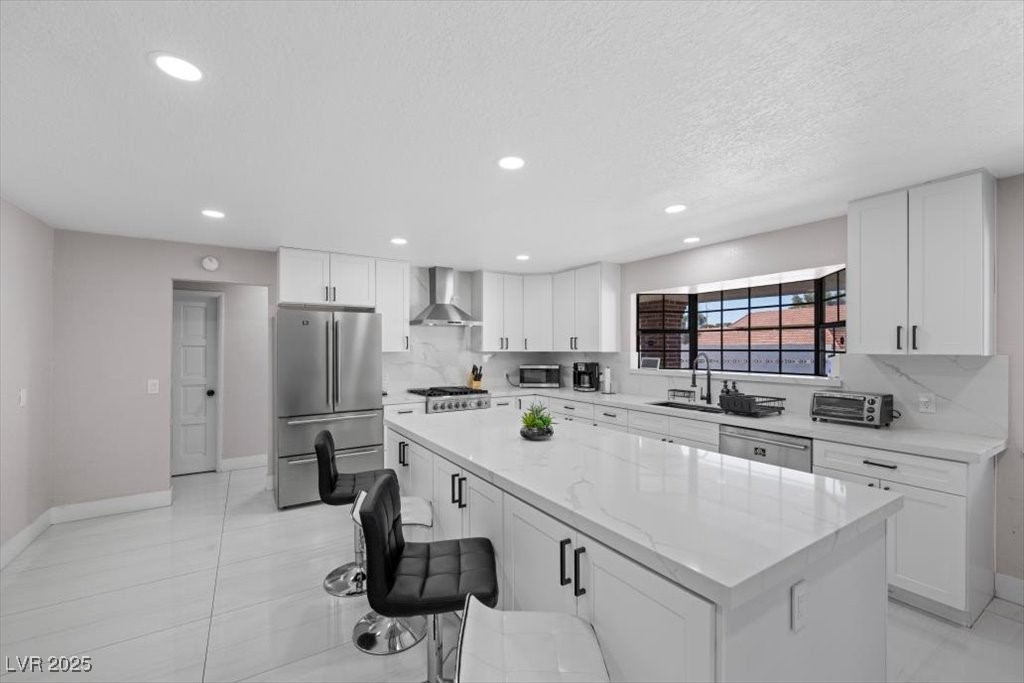 5110 Evaline Street Las Vegas, NV 89120 - Photo 5 of 55 Stainless steel appliances and an oversized island creates a kitchen that’s both functional and elegant.