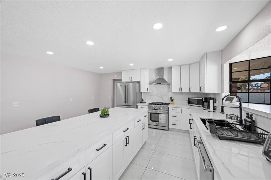 5110 Evaline Street Las Vegas, NV 89120 - Photo 8 of 55 Gourmet kitchen showcases refined aesthetics and high-end stainless steel appliances, ideal for creating memorable meals.