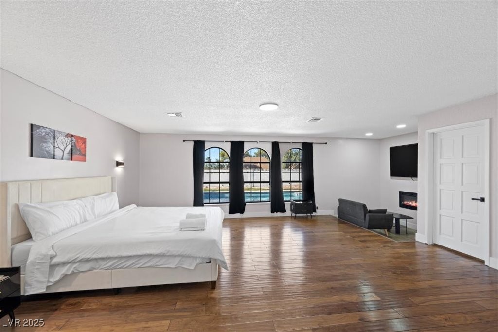 5110 Evaline Street Las Vegas, NV 89120 - Photo 10 of 55 Inviting primary suite with expansive windows and peaceful ambiance.