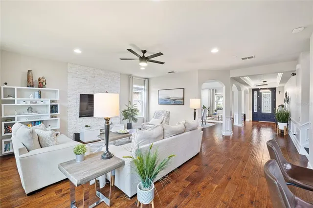 a bathroom with a granite countertop sink a toilet and shower