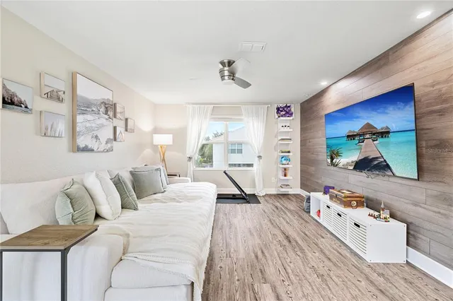 an aerial view of multiple houses with a big yard