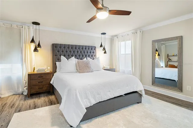 an aerial view of residential houses with outdoor space and swimming pool