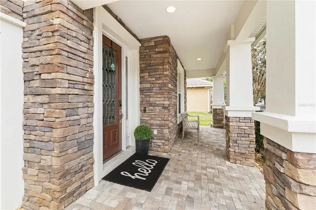 a living room with furniture windows and wooden floor
