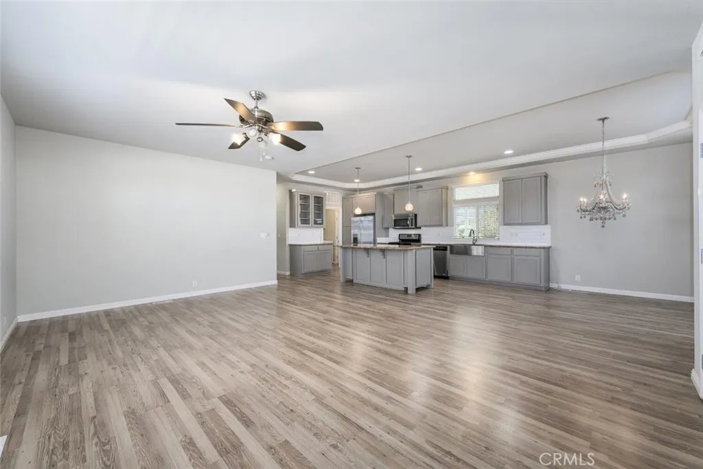 16222 Monterey Lane, Unit 285 Huntington Beach, CA 92649 - Photo 15 of 59 a view of kitchen and hall with wooden floor