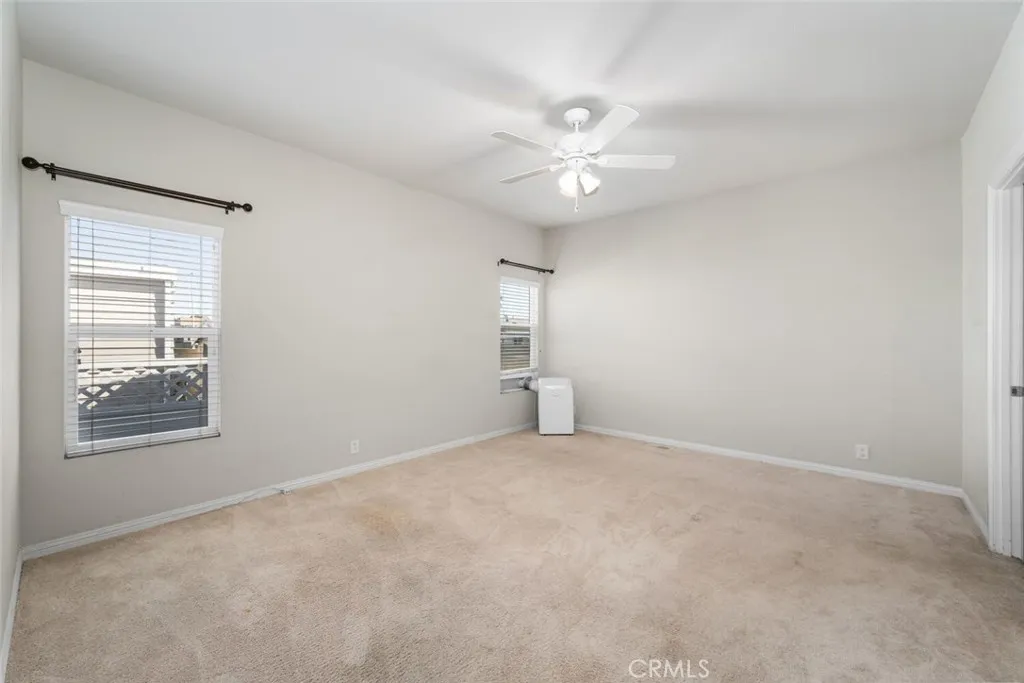 16222 Monterey Lane, Unit 285 Huntington Beach, CA 92649 - Photo 24 of 59 a view of an empty room with a window
